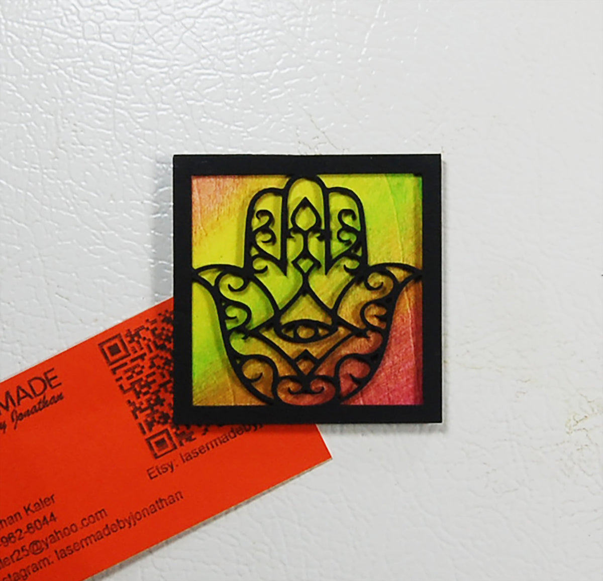 Hand-painted basswood Hamsa magnet in a colorful finish