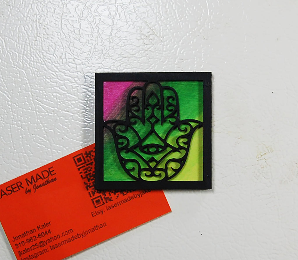 Hand-painted basswood Hamsa magnet in a colorful finish
