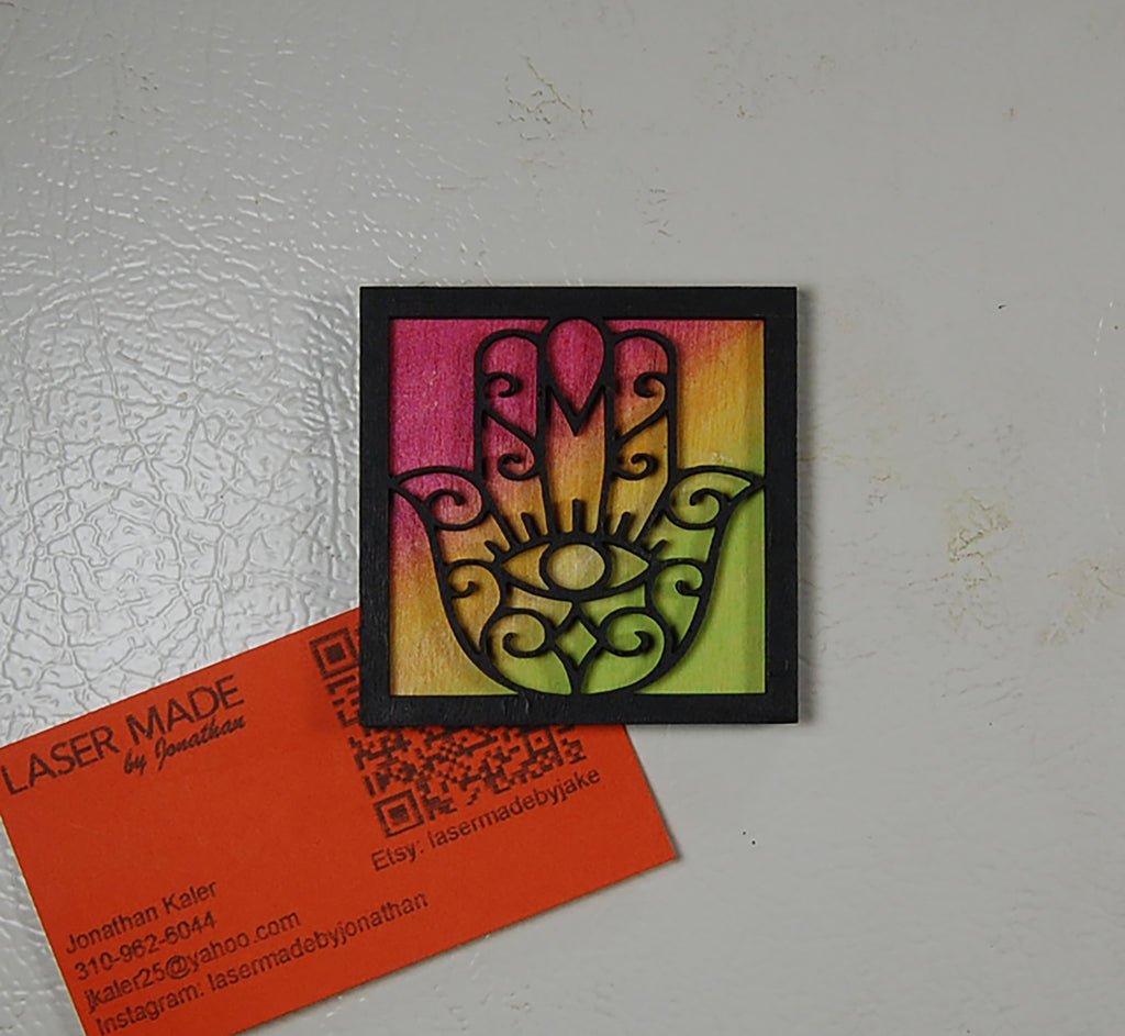Hand-painted basswood Hamsa magnet in a colorful finish