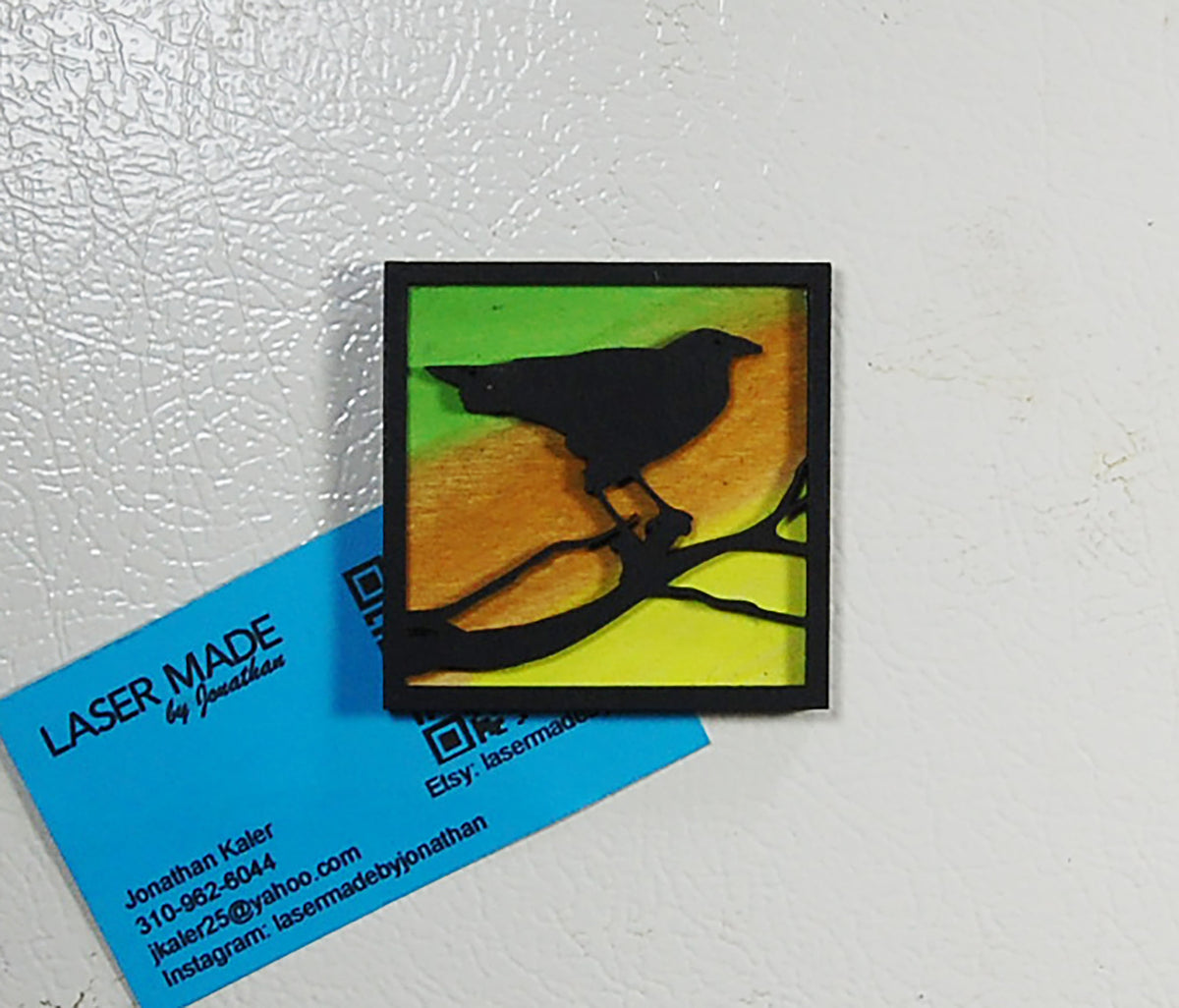 Hand-painted basswood raven magnet