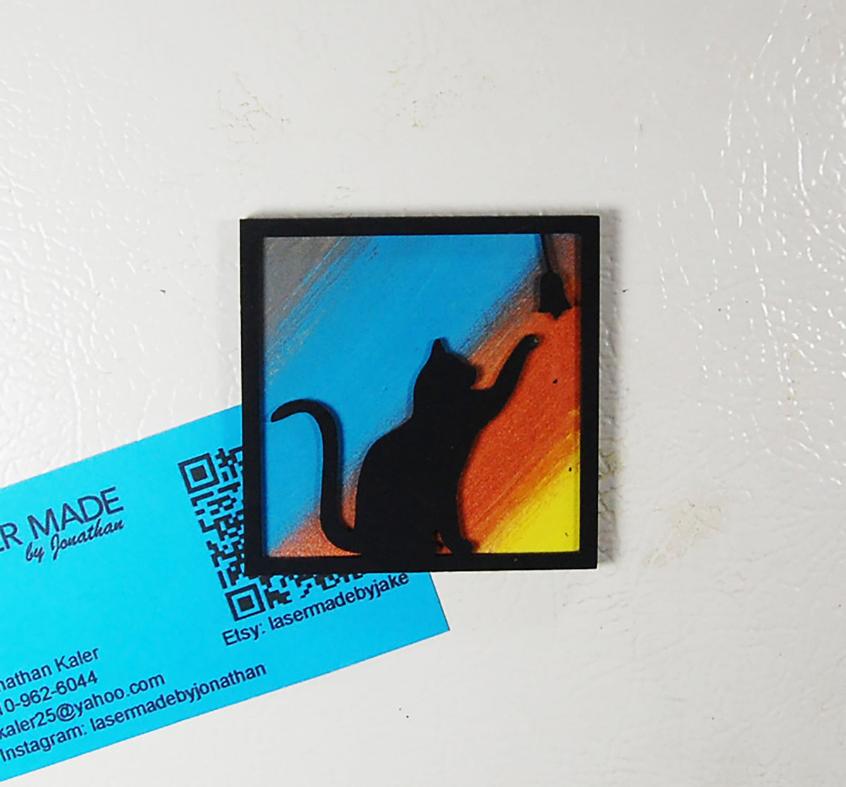 Hand-painted basswood magnet featuring a cat silhouette