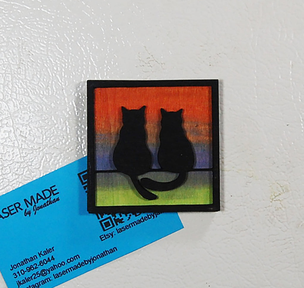 Hand-painted basswood magnet featuring two cats