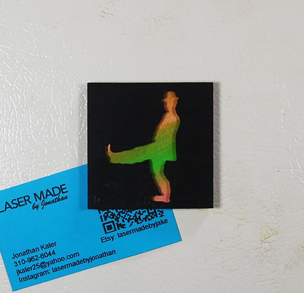 Hand-painted basswood magnet featuring a colorful figure