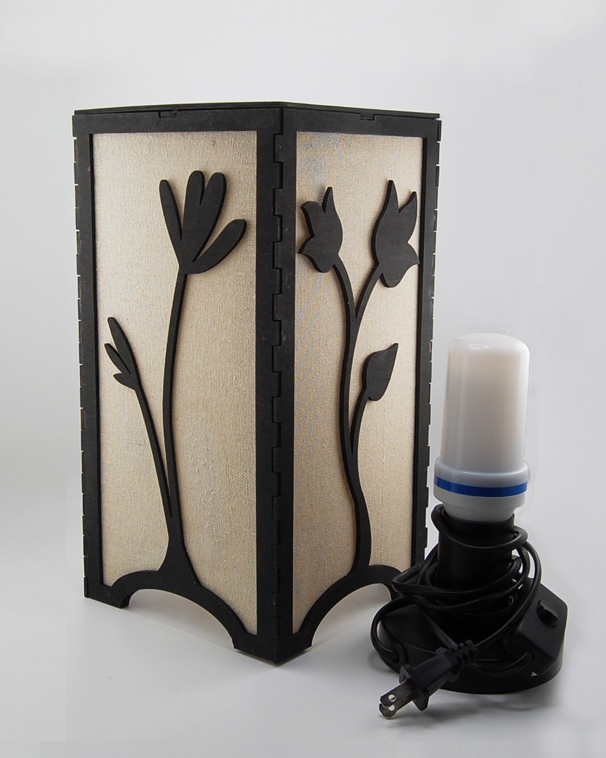 Floral tulip lantern with bulb base and flickering bulb shown beside it