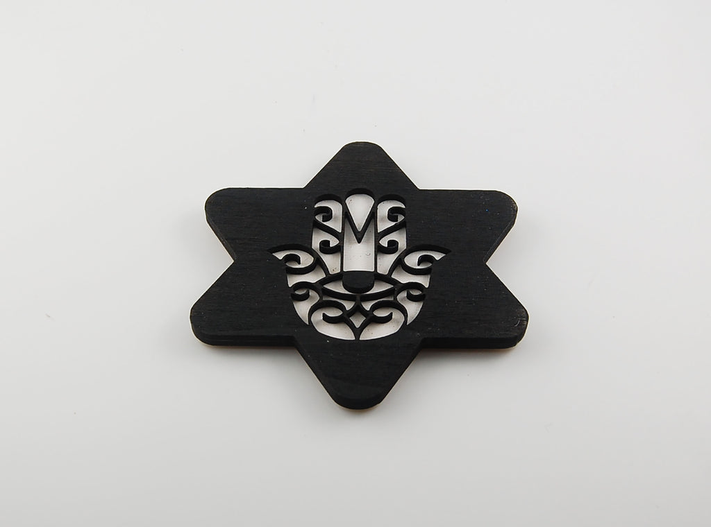 Star-shaped coaster with a Hamsa and eye design in laser-cut linework