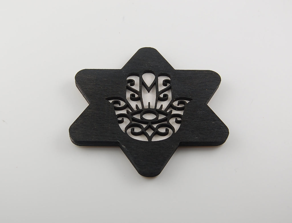 Star-shaped coaster with a geometric Hamsa and Star of David pattern