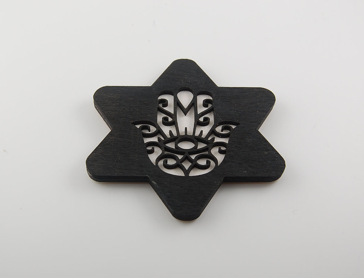 Star-shaped coaster with a geometric Hamsa and Star of David pattern