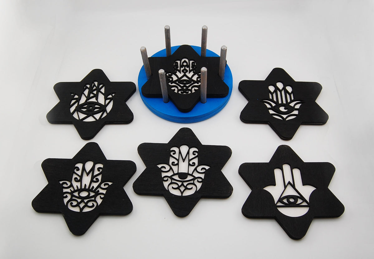 Six star-shaped Hamsa and Star of David Judaica coasters arranged together