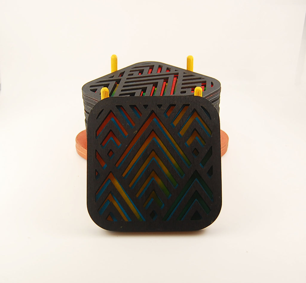 Square laser-cut coaster with a multicolor angular pattern