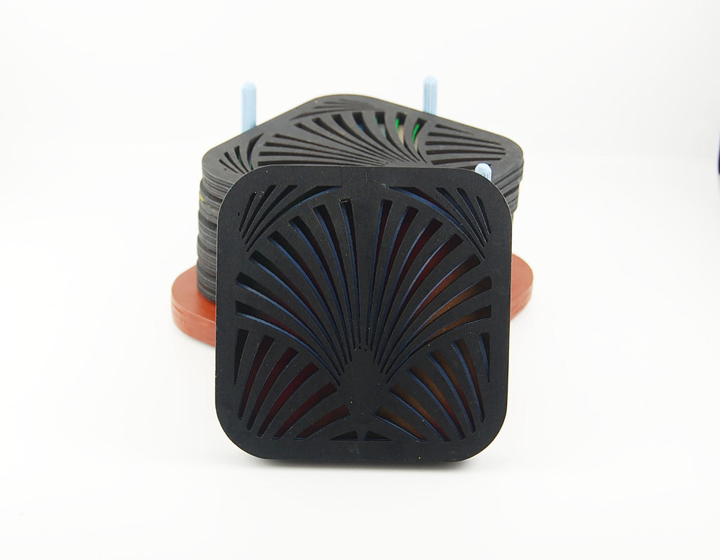 Square coaster with dark fan pattern and colorful layered design