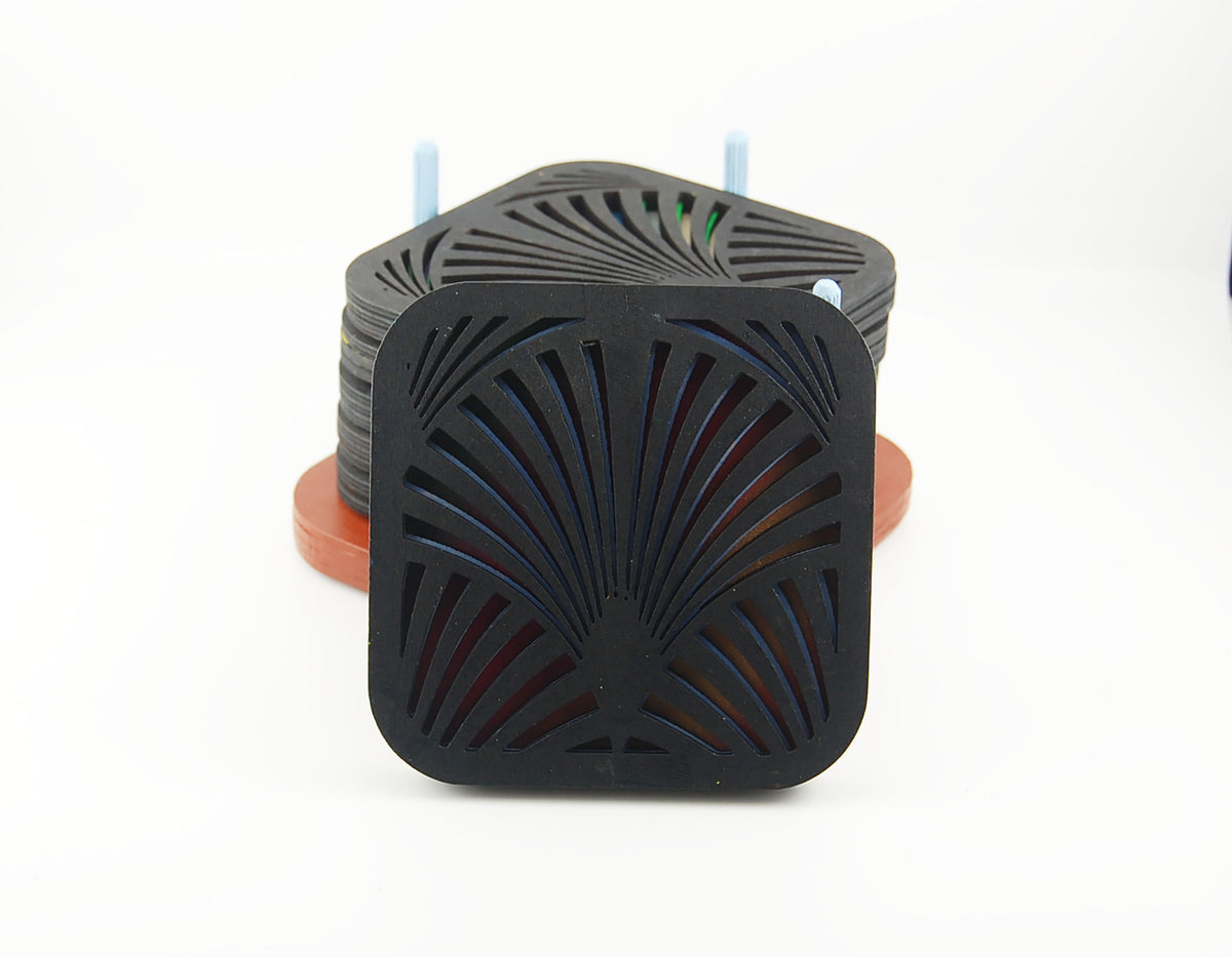 Square coaster with dark fan pattern and colorful layered design