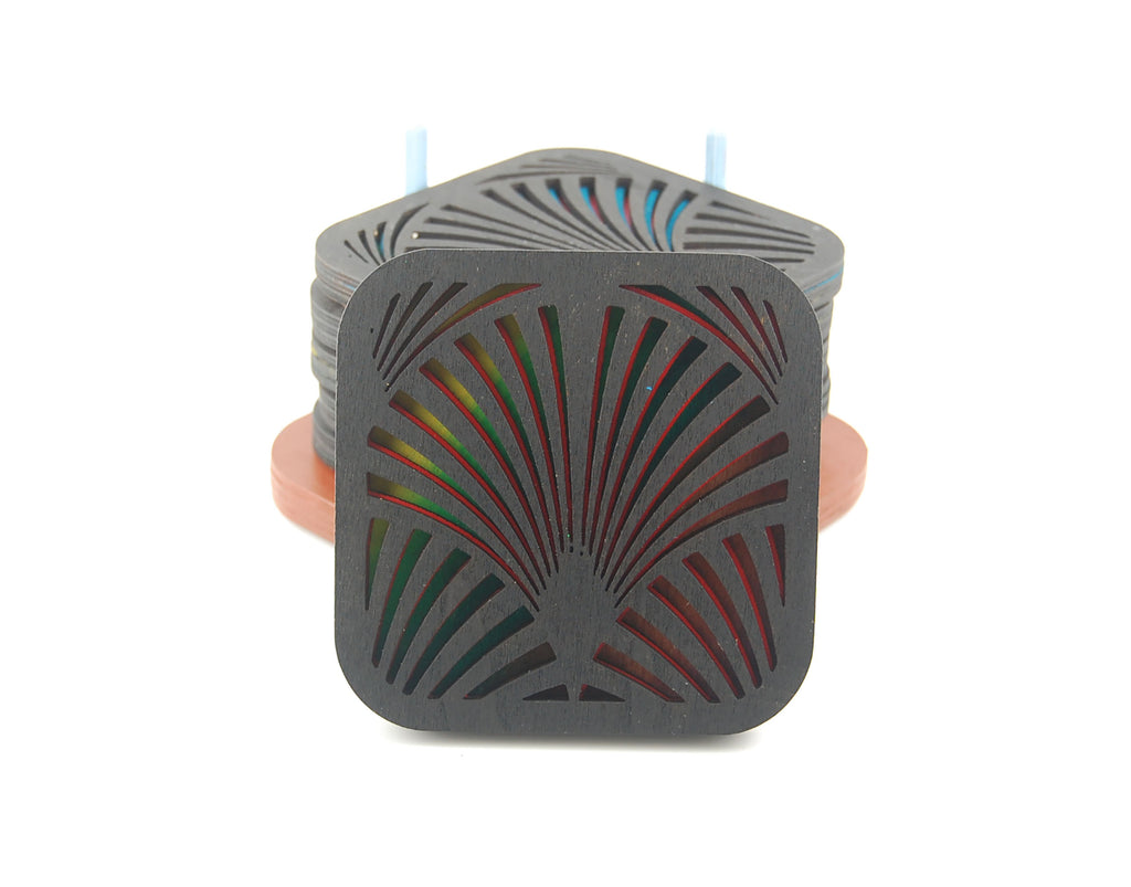 Square Deco laser-cut coaster set stacked in a colorful storage holder