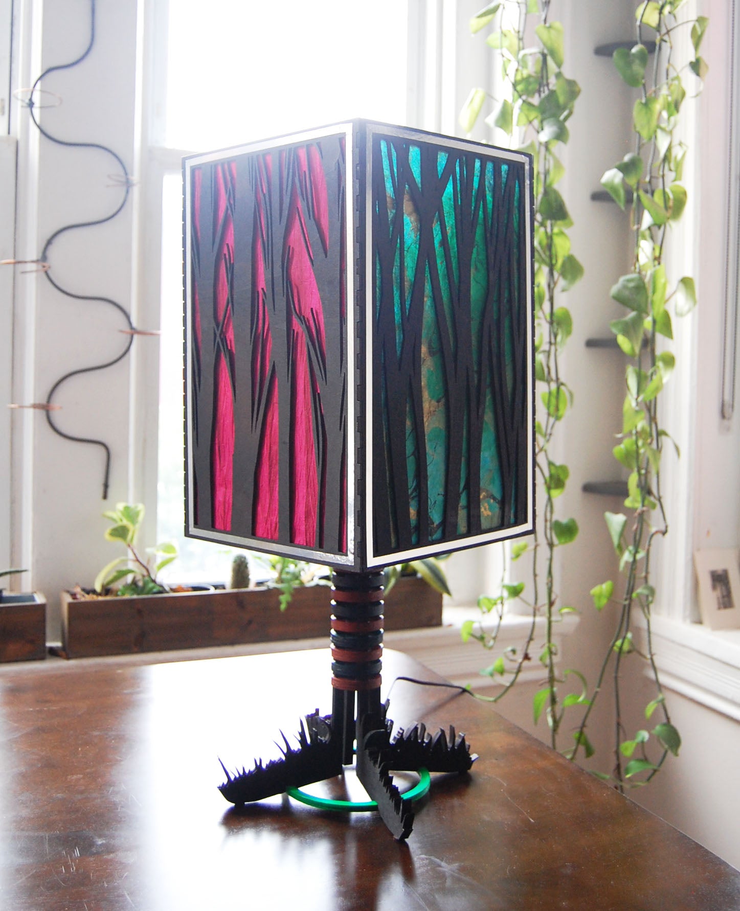 Forest Light lamp unlit second angle showing full silhouette and grass base
