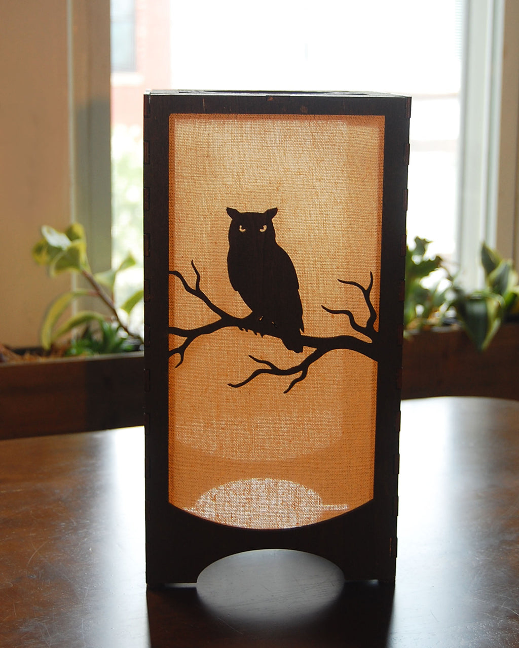 Handmade laser-cut wildlife lantern —  owl silhouette in natural light